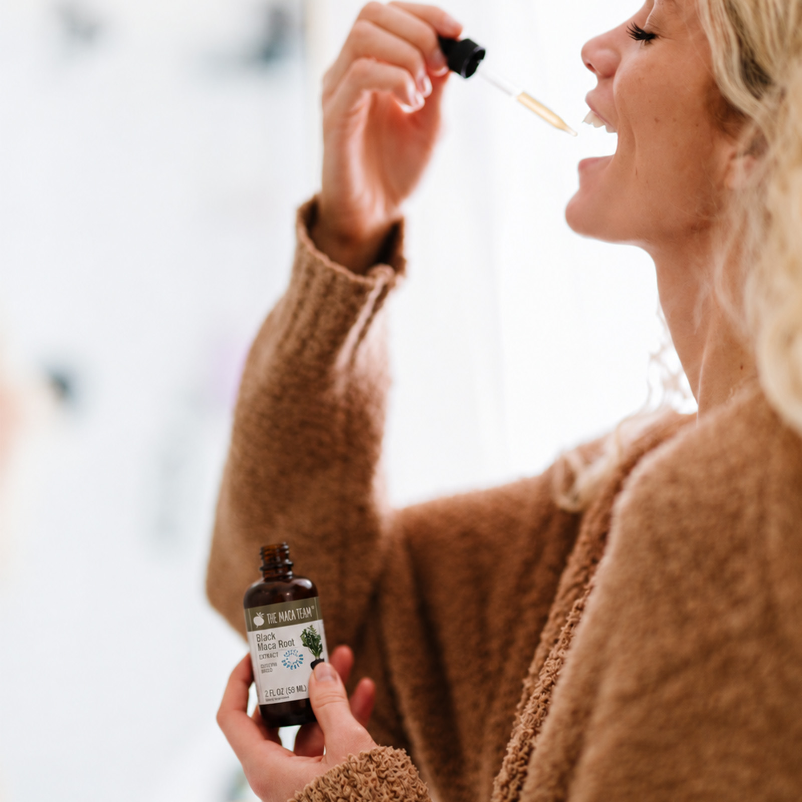 Taking Black Maca liquid extract with a dropper