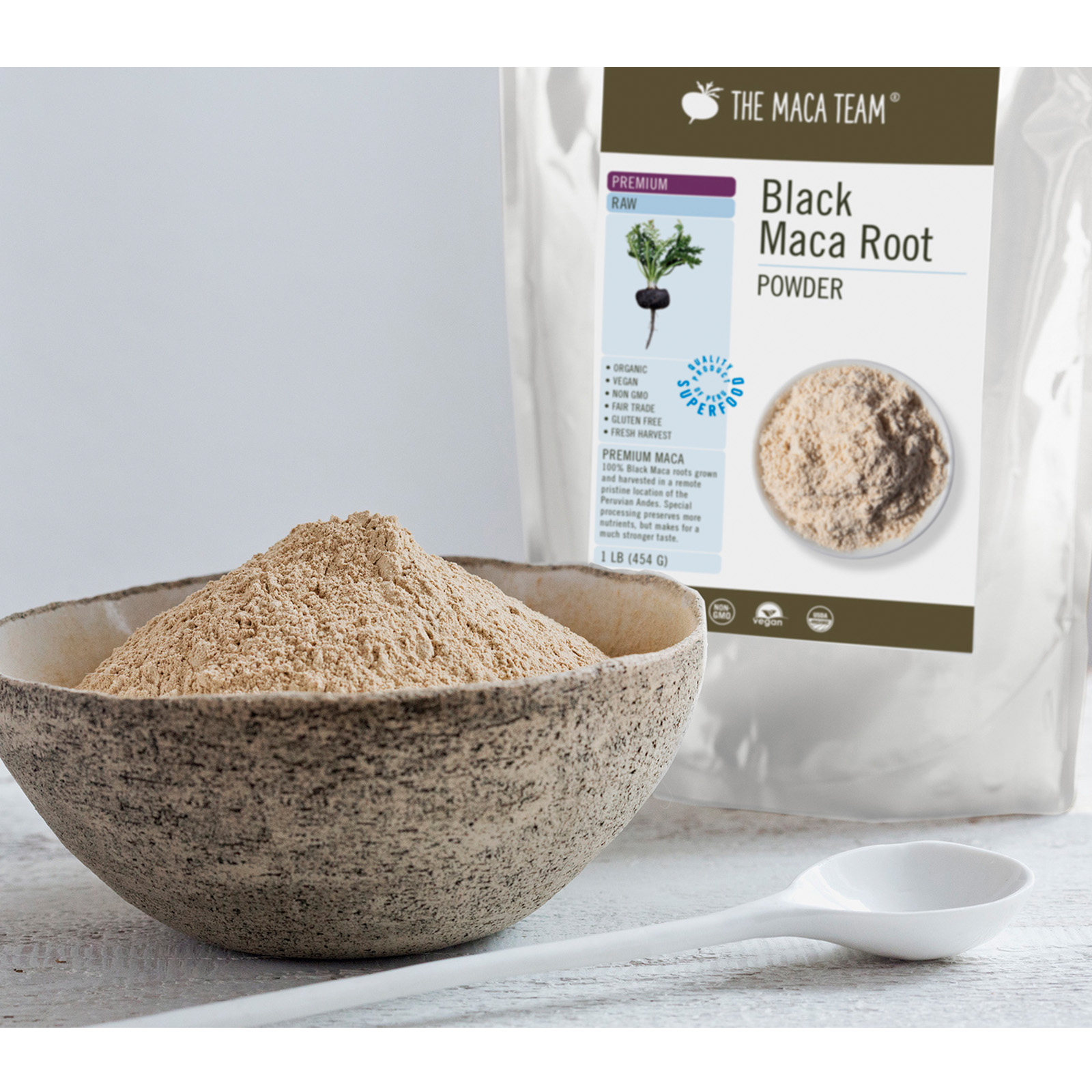 Organic Premium Raw Black Maca Powder from The Maca Team in a bowl with bag