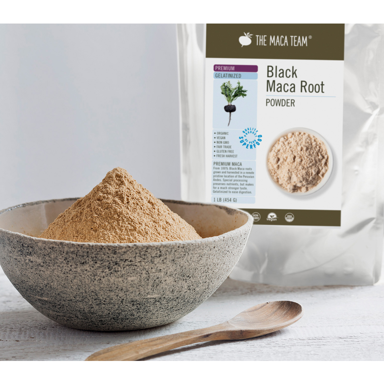 Organic Premium Gelatinized Black Maca Powder from The Maca Team in a bowl with bag