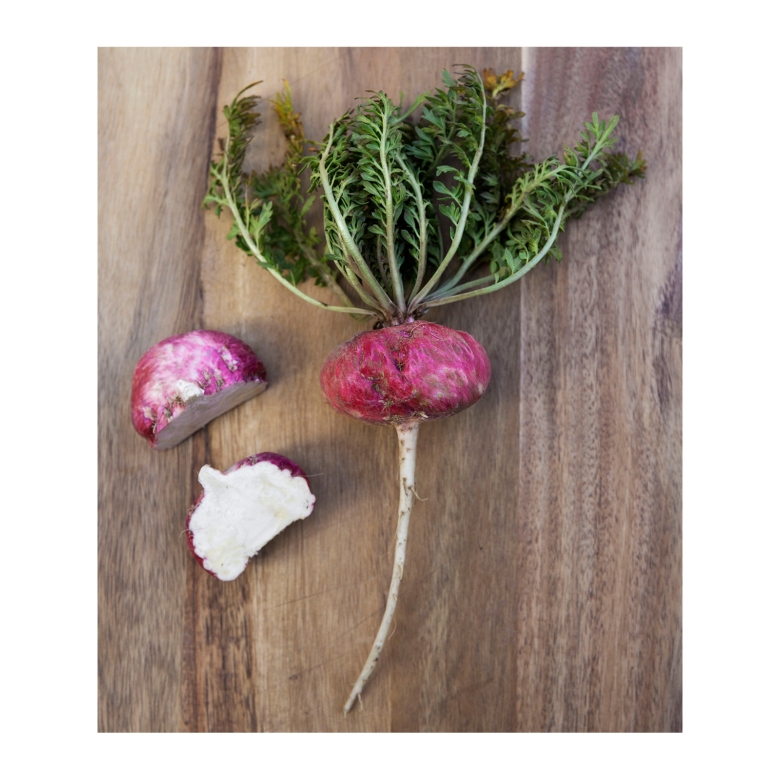 Organic Raw Red Maca root freshly cut open on a cutting board
