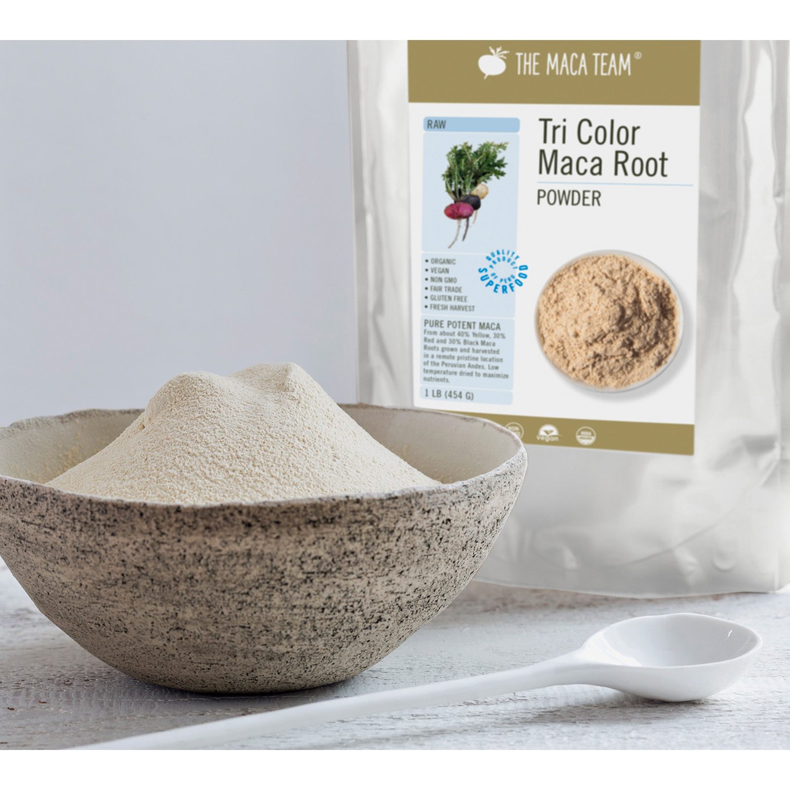 Organic Raw Tail Color Maca Powder from The Maca Team in a bowl with bag