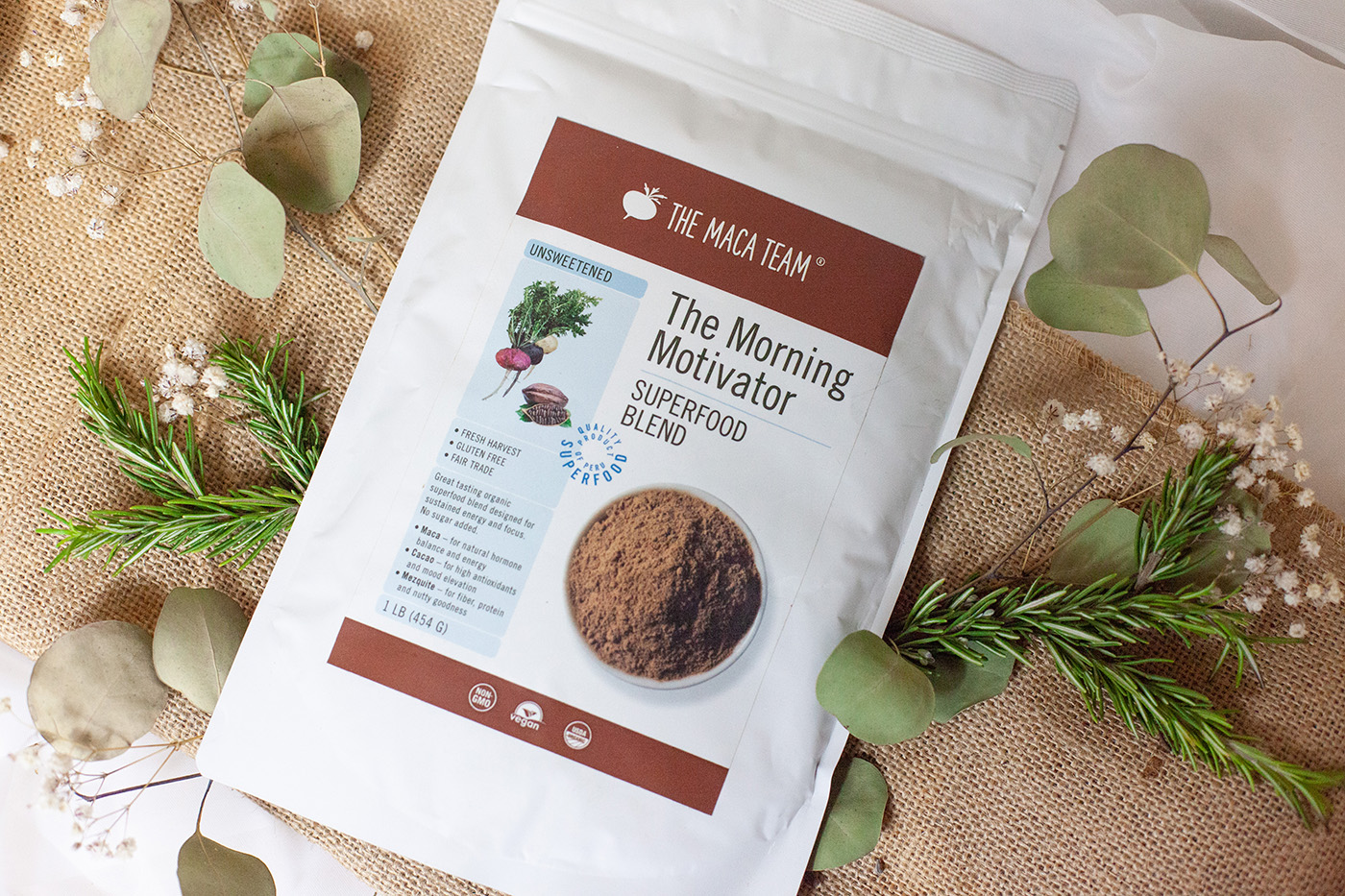 Morning Motivator bag surrounded by natural botanical ingredients
